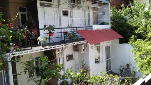 an apartment building with a red mat on the balcony at Mini's Residence in Colombo