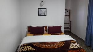 Postel nebo postele na pokoji v ubytování B&B Nuwara eliya