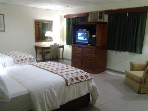 Postel nebo postele na pokoji v ubytování Micro Hotel Condo Suites