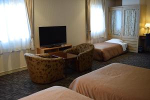 Postel nebo postele na pokoji v ubytování Asakusa Central Hotel