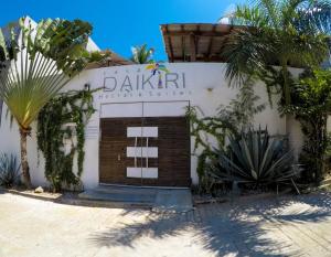 a building with a sign on the side of it at Casa Daikiri in Puerto Escondido