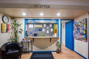 a reception area of an office with a blue door at Albion Manor in Brisbane