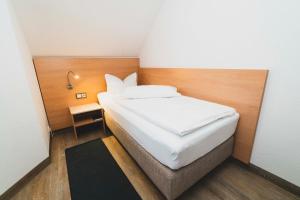 Ein Bett oder Betten in einem Zimmer der Unterkunft Pension & Restaurant Nordstern