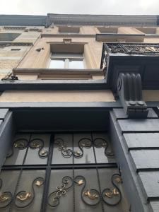 a window of a building with at Prestige Flats Coteaux in Brussels +4 photos