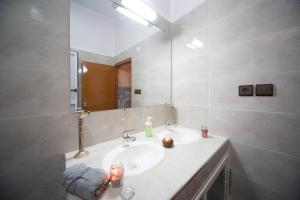 a bathroom with a sink and a mirror at Dar Widad in Ouarzazate