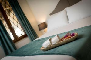 Postel nebo postele na pokoji v ubytování La Ripa Boutique Hotel