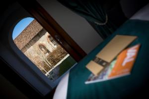 Postel nebo postele na pokoji v ubytování La Ripa Boutique Hotel