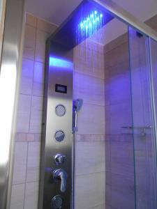 a shower with purple lights in a bathroom at Cottage with pool,views in Citta' Sant'Angelo +45 photos