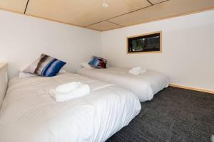 Krevet ili kreveti u jedinici u okviru objekta Cozy Tiny House Hideaway