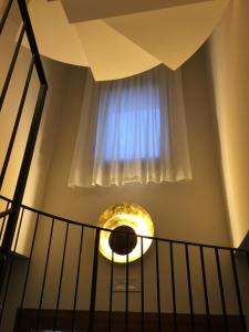 a spiralling staircase with a window at Crystal Luxury House in Fiume Veneto