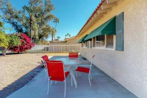 a table and chairs sitting outside of a building at Indio Desert Diamond Permit# 50842 in Indio