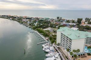 an aerial view of a marina with boats docked at Harbourside at Marker Condos in Clearwater Beach