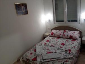 Postel nebo postele na pokoji v ubytování Apartmani M&V
