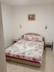 Postel nebo postele na pokoji v ubytování Apartmani M&V