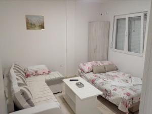 Postel nebo postele na pokoji v ubytování Apartmani M&V