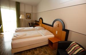 Voodi või voodid majutusasutuse Hotel Fuchspalast toas