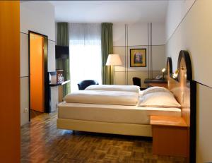 Voodi või voodid majutusasutuse Hotel Fuchspalast toas