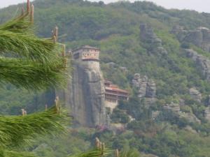 a building on the side of a mountain at Hotel Doupiani House in Kalabaka