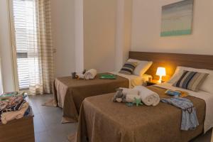 Postel nebo postele na pokoji v ubytování MareinSicilia: Appartamenti Larica