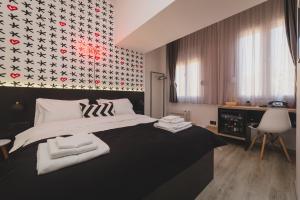 Postel nebo postele na pokoji v ubytování Hotel Marienplatz Podgorica