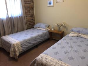A bed or beds in a room at Bronte Court No 3 at South West Rocks