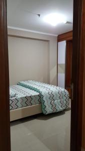 Postel nebo postele na pokoji v ubytování Gateway Pasteur 2 BR tower depan Jade 11 C