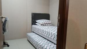 Postel nebo postele na pokoji v ubytování Gateway Pasteur 2 BR tower depan Jade 11 C