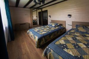 Кровать или кровати в номере Парк-отель Медвежья гора