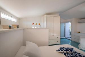 En eller flere senge i et værelse på Sul Mare Sardegna Villa Nesea