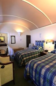 Postel nebo postele na pokoji v ubytování Meryan House Hotel