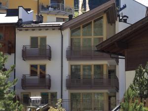 an apartment building with balconies on the side of it at Haus Annakogl und Haus Barbara in Obergurgl