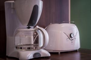Coffee and tea making facilities at BpR Turquoise Simplicity Apartment