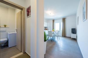 a living room with a toilet and a table at Villa Niki 2 in Cavtat