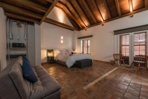 Postel nebo postele na pokoji v ubytování Getsemani Cartagena Hotel + 37 fotografií