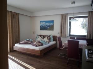 Postel nebo postele na pokoji v ubytování Residence Haus Peder