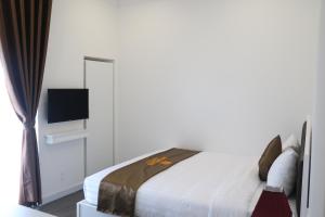 Кровать или кровати в номере Arapang Hotel 2