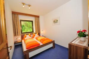 Postel nebo postele na pokoji v ubytování Residence Haus Peder