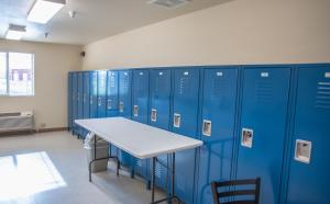 a row of blue lockers in a locker room at Welcome Suites - Minot, ND in Minot