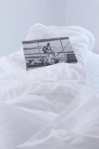 A bed or beds in a room at Aether Boutique Stay