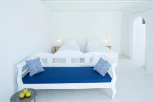 A bed or beds in a room at Aether Boutique Stay