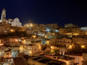 a view of a city at night at Mikasa in Matera