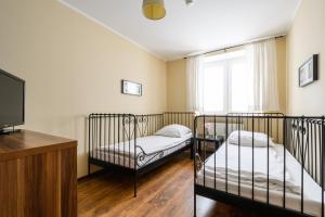 Posteľ alebo postele v izbe v ubytovaní Noclegi Krokodyl-Stara Praga