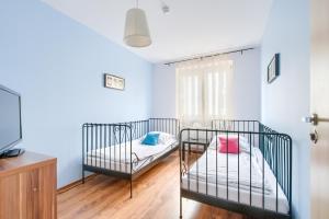 Posteľ alebo postele v izbe v ubytovaní Noclegi Krokodyl-Stara Praga