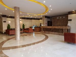 a lobby of a hotel with a large lobby with a lobby at Farha International 2 Residential Units in Jeddah