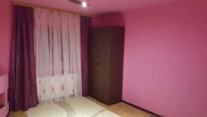 Postel nebo postele na pokoji v ubytování Vila Ella