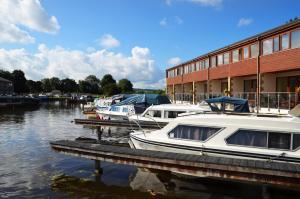 a group of boats are docked at a marina at Tewitfield Marina in Carnforth