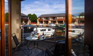 a balcony with a table and a view of a marina at Tewitfield Marina in Carnforth +91 photos