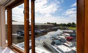 a view from a window of boats in a marina at Tewitfield Marina in Carnforth