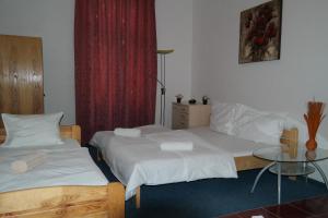 Postel nebo postele na pokoji v ubytování Hotel Praha Club bed & breakfast