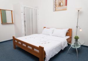 Postel nebo postele na pokoji v ubytování Hotel Praha Club bed & breakfast